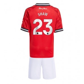 Manchester United Luke Shaw #23 Hemmatröja Barn 2025-26 Kortärmad (+ Korta byxor)